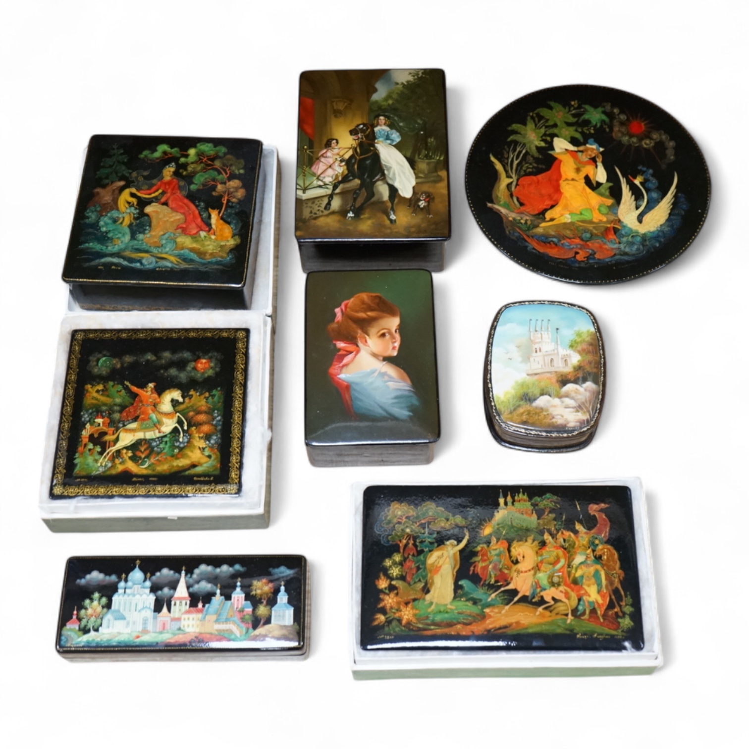 Seven Russian lacquer boxes to include signed examples and a similar dish, 18cm diameter. Condition - varies